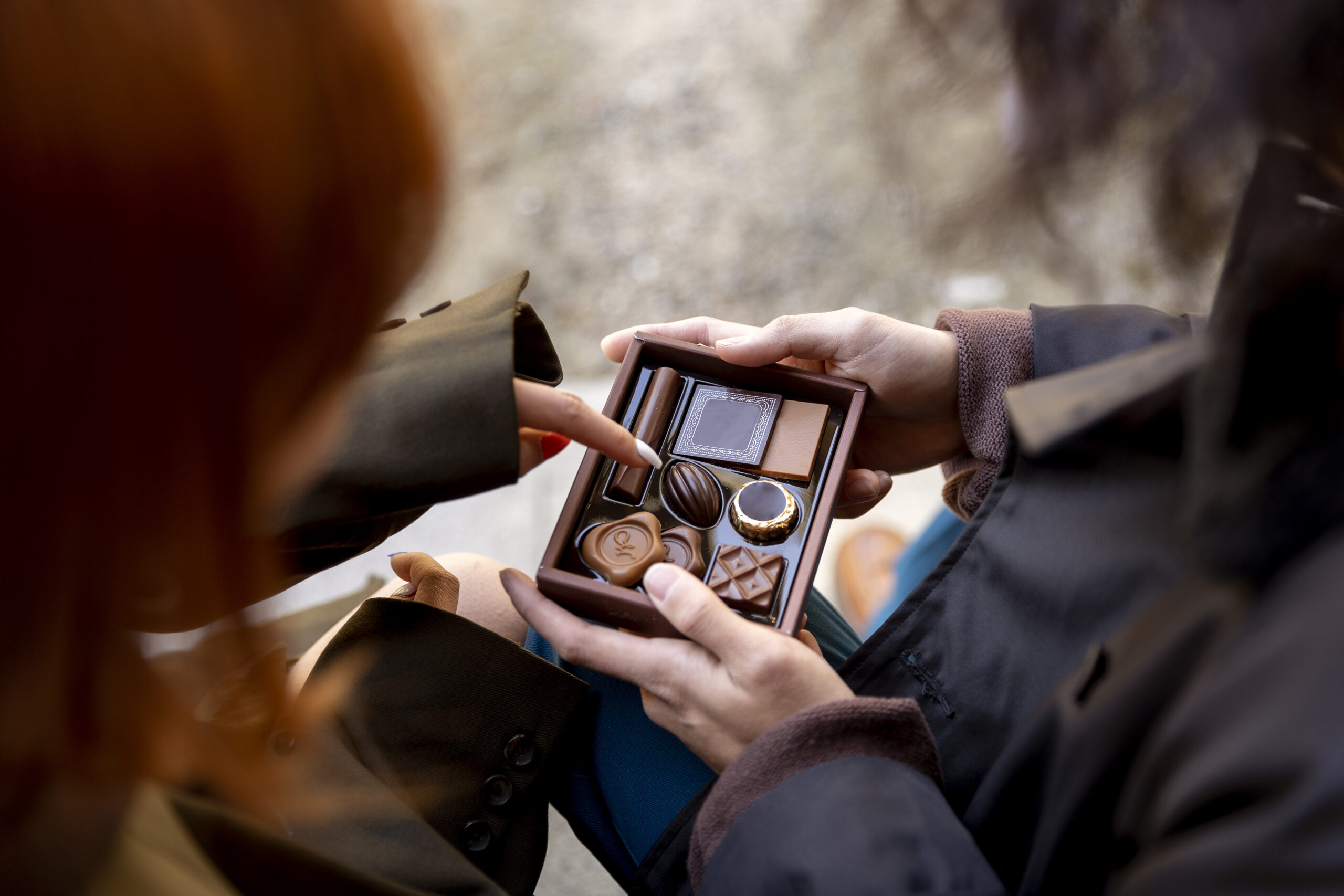 high-angle-japanese-couple-eating-chocolate-sweets-scaled.jpg